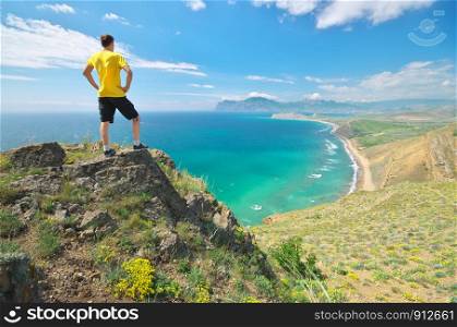 Man enjoy the nature landscape. Sea and mountain.