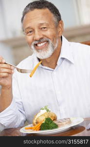 Man Enjoying A Meal At Home