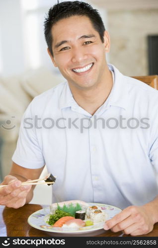 Man Enjoying Chinese Food With Chopsticks