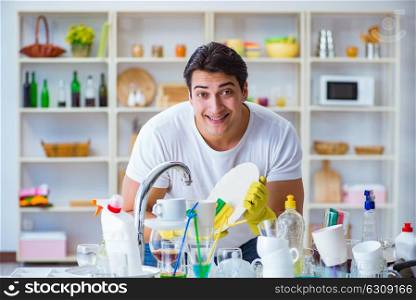 Man enjoying dish washing chores at home