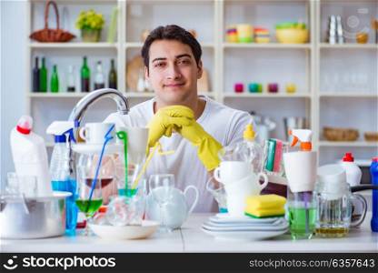 Man enjoying dish washing chores at home