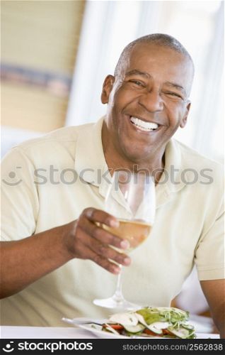 Man Enjoying meal,mealtime With A Glass Of Wine