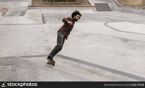 man enjoying skateboarding outdoors park