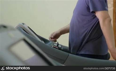 Man exercising on stepmill in the gym. Getting in some cardio is effective for health and weight loss