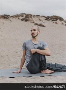 man exercising yoga outdoors