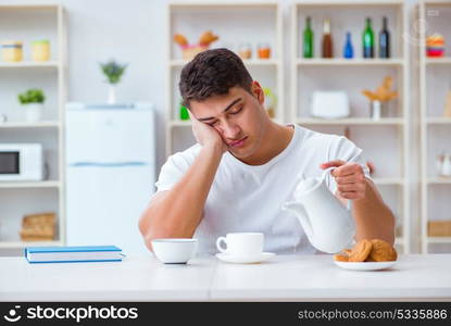 Man falling asleep during his breakfast after overtime work