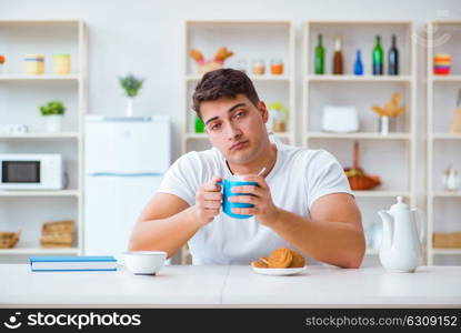 Man falling asleep during his breakfast after overtime work