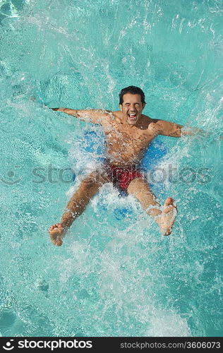 Man falling into swimming pool