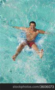 Man falling into swimming pool