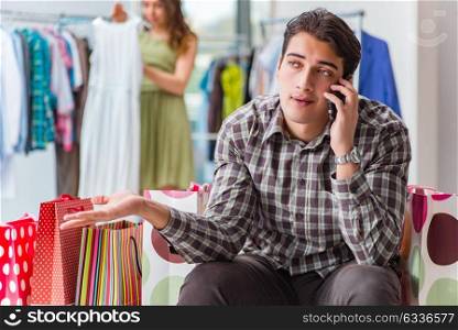 Man fed up with wife shopping in shop