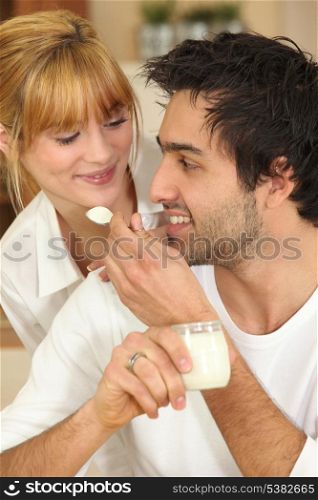 Man feeding his girlfriend