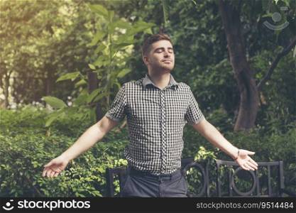 Man feeling relax while enjoy freedom in the park. Relaxation lifestyle concept.