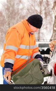 Man filling woman car gas snow assistance winter breakdown help