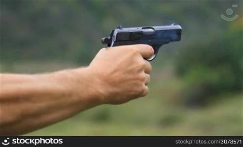 Man firing from a gun to target