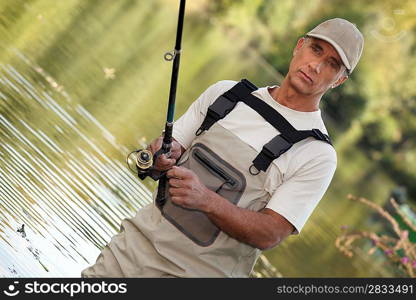 Man fishing in lake