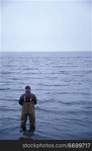 Man Fishing in Ocean