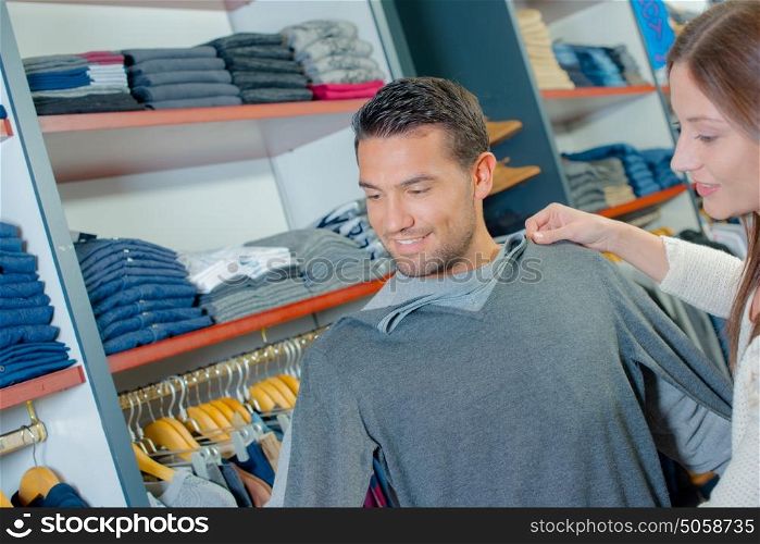 man fitting a top