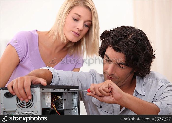 Man fixing a computer