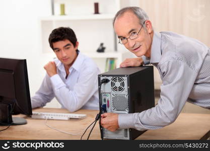 Man fixing a computer