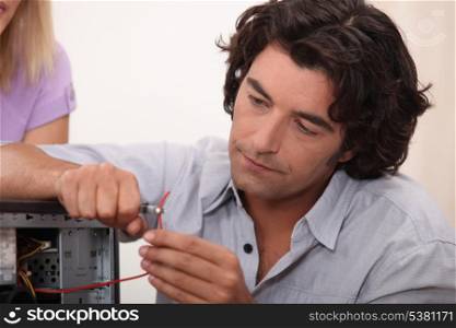 Man fixing a hard drive