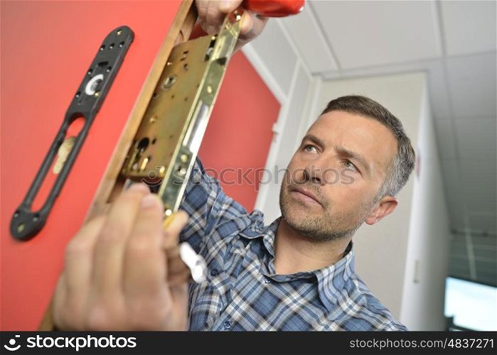 Man fixing door