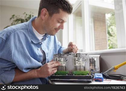 Man Fixing Electric Toaster Rather Than Buying New Product Sustainable Lifestyle
