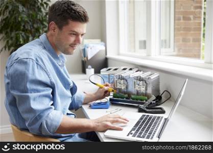 Man Fixing Electric Toaster Using Online Instructions Rather Than Buying New Product Sustainable Lifestyle