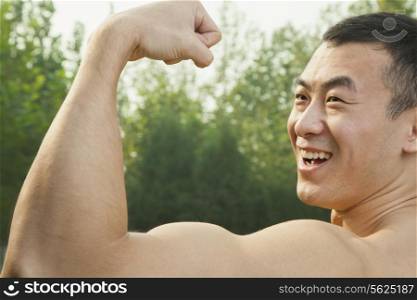 Man Flexing Muscles