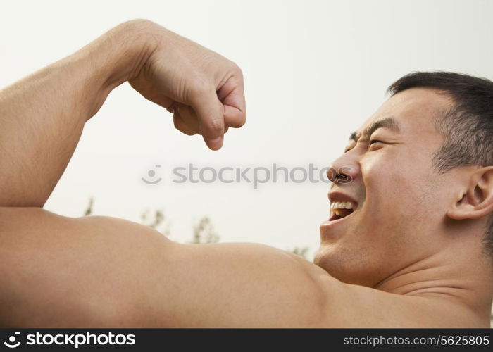 Man Flexing Muscles