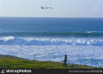 Man flies model plane on Lisbon coast