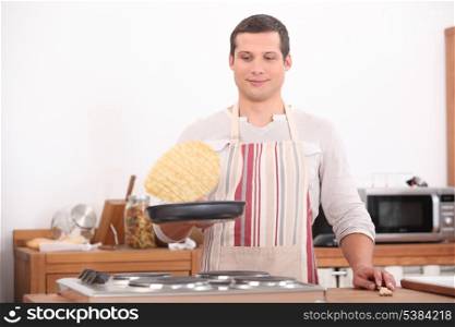 Man flipping pancake