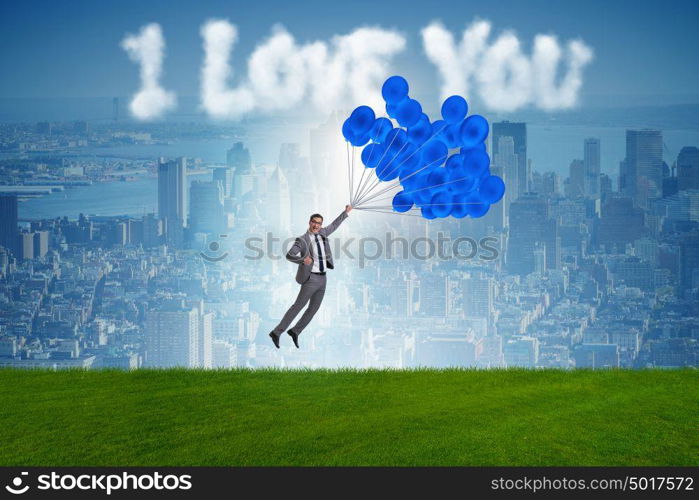 Man flying balloons in romantic concept