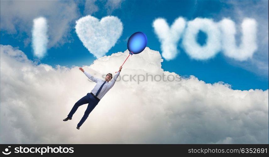 Man flying balloons in romantic concept