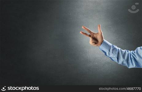 Man gesturing with fingers. Hand of businessman showing two gesture with fingers