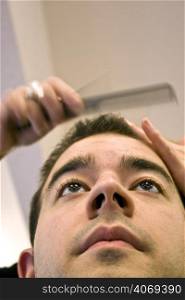 Man getting hair cut