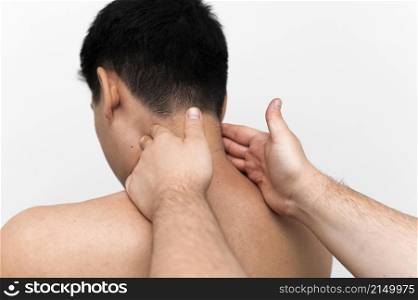man getting neck massage from physiotherapist