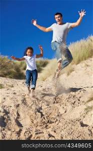 Man & Girl, Happy Father and Daughter Jumping At Beach