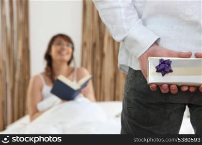 man giving a gift to his girlfriend