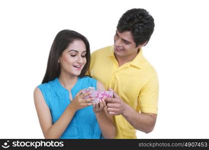 Man giving a gift to his woman friend