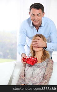 Man giving a present to woman