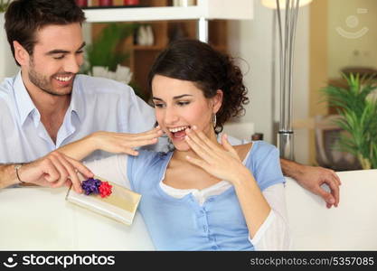 Man giving gift to girlfriend