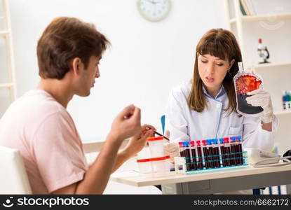 Man giving his blood as a donor