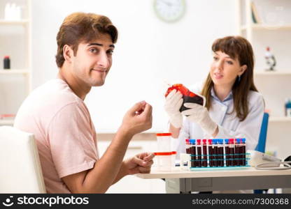 Man giving his blood as a donor