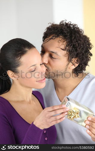 Man giving his girlfriend a present