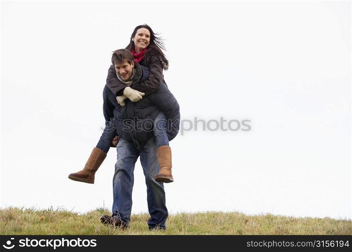 Man Giving His Wife Piggy Back Ride