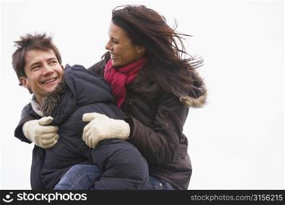 Man Giving His Wife Piggy Back Ride