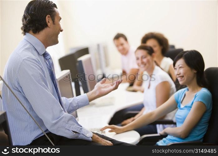 Man giving lecture in computer class