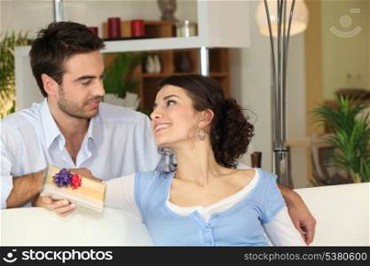 Man giving present to woman