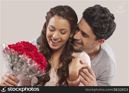 Man giving woman a bouquet of flowers
