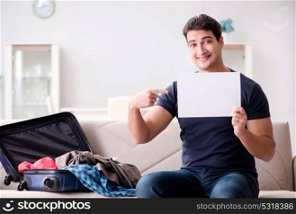 Man going on vacation packing his suitcase